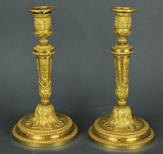 Appraisal: Pair of Louis XVI style ormolu candlesticks Pair of Louis