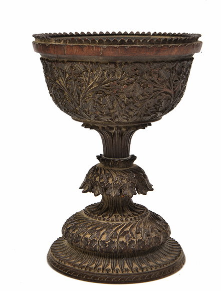 Appraisal: AN ANTIQUE POSSIBLY BURMESE HARDWOOD CUP with detailed carved foliate