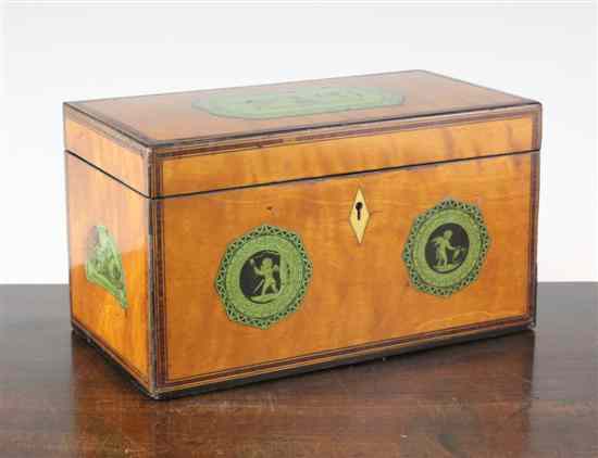 Appraisal: A Regency satinwood tea caddy decorated with printed panels of