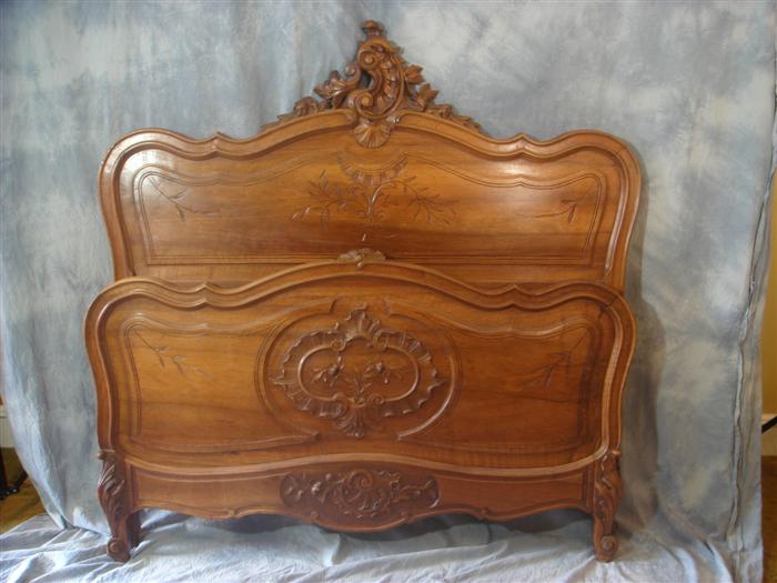 Appraisal: Carved walnut French bed h Estimate -