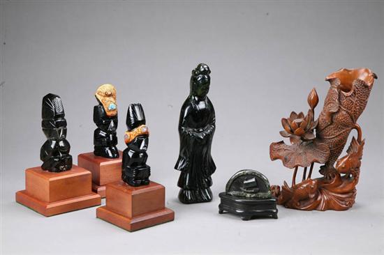 Appraisal: SIX ASIAN CARVINGS Stone robed figure h three black stone