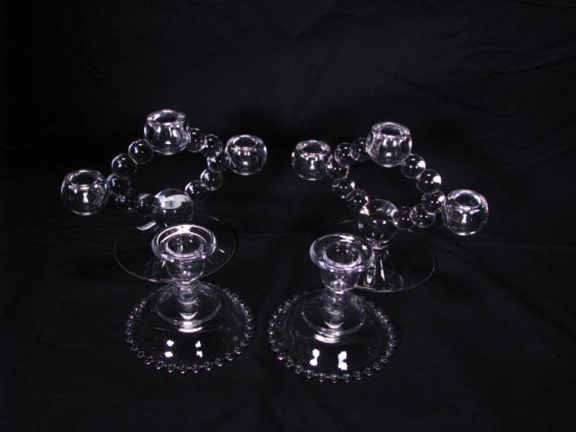 Appraisal: Candlewick Glass pair of candlesticks one pair triple candleholders one