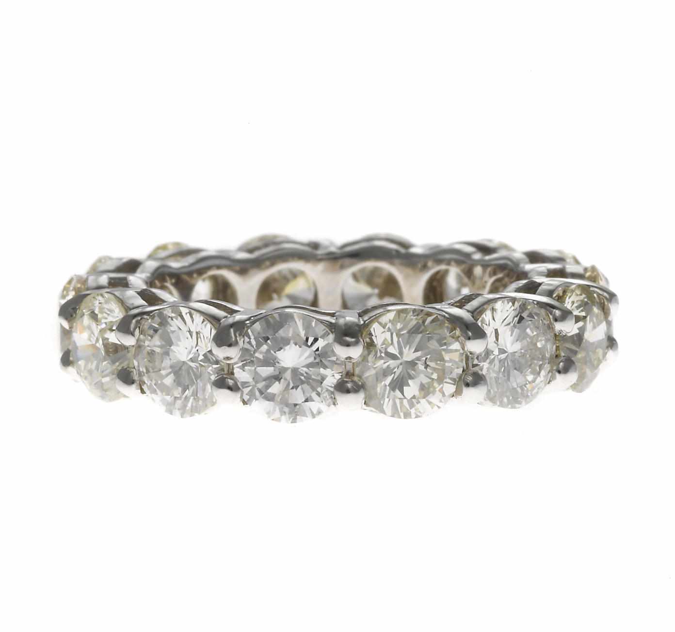 Appraisal: A diamond eternity band estimated total diamond weight carats mounted