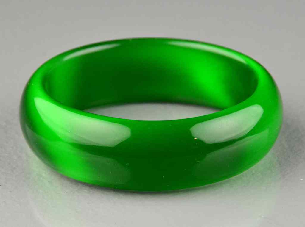 Appraisal: Chinese Jade Style Bangle BraceletOf a transparent jade style color