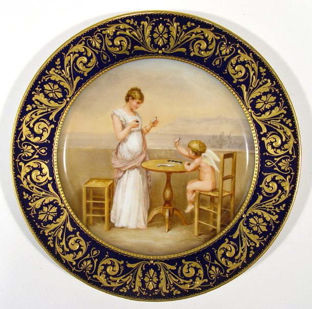 Appraisal: Continental porcelain plate painted with a cherub and young maiden