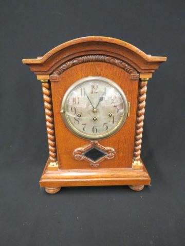 Appraisal: German Oak Bracket Clock twist columns beveled pedulum view musical