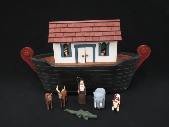 Appraisal: Wooden Noah's Ark with carved animals boat is long tall