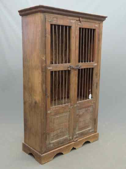 Appraisal: Primitive two cupboard with spindle doors '' W '' D