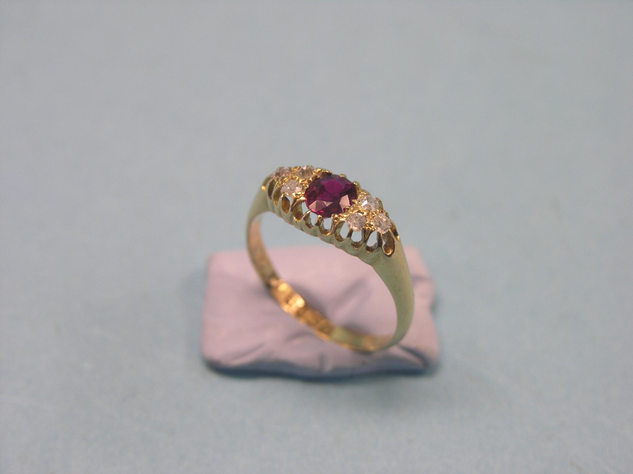 Appraisal: An Edward VII ct gold half-hoop ring central ruby and