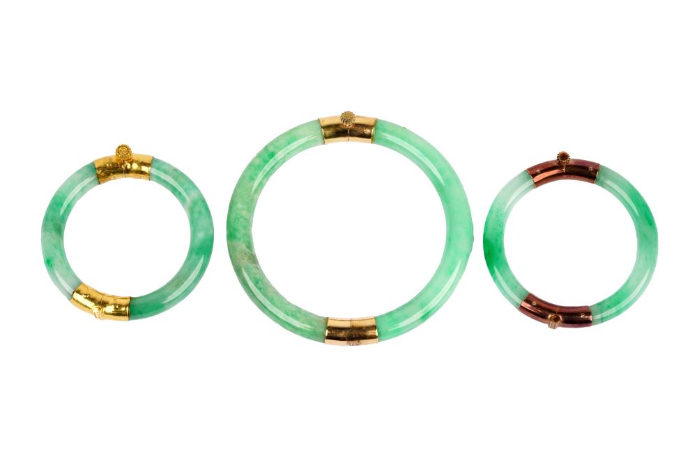 Appraisal: THREE KARAT GOLD JADE BANGLEScomprising two mini bangles with dyed