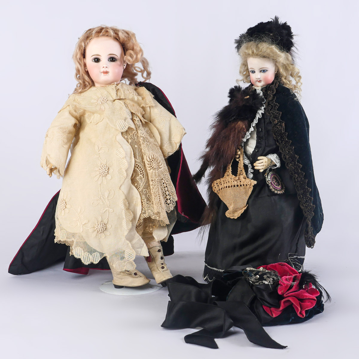 Appraisal: BISQUE DOLLS - Bisque dolls with glass eyes on stands