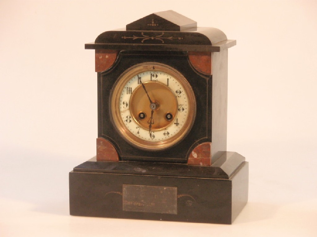 Appraisal: A late Victorian slate mantel clock of eight-day movement striking