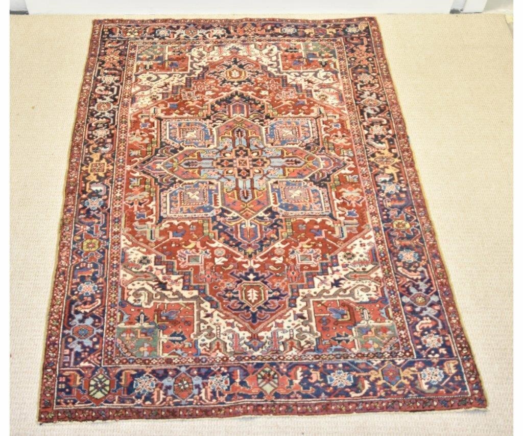 Appraisal: Room size Heriz carpet blue center geometric medallion red field