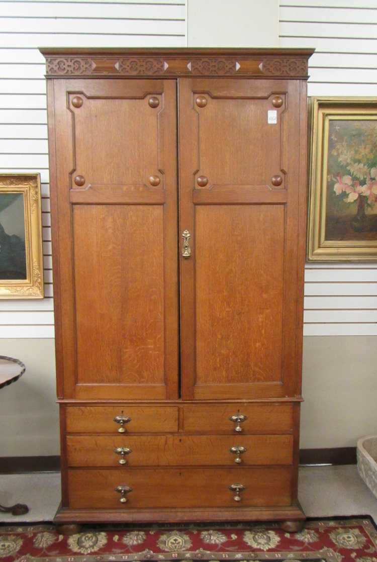 Appraisal: AN OAK WARDROBE ON CHEST English early th century a