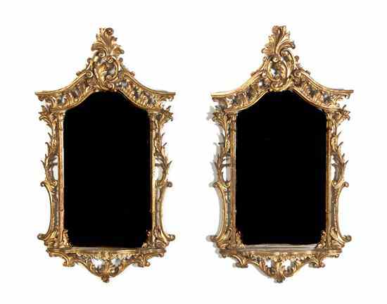 Appraisal: A Pair of Italian Baroque Style Giltwood Mirrors having a