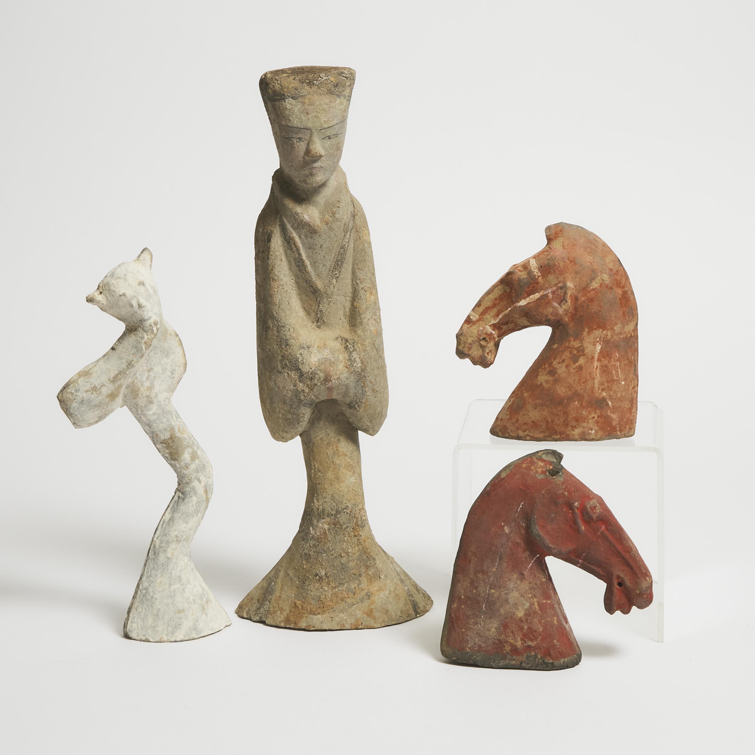 Appraisal: A Group of Four Pottery Figures and Horse Heads Han