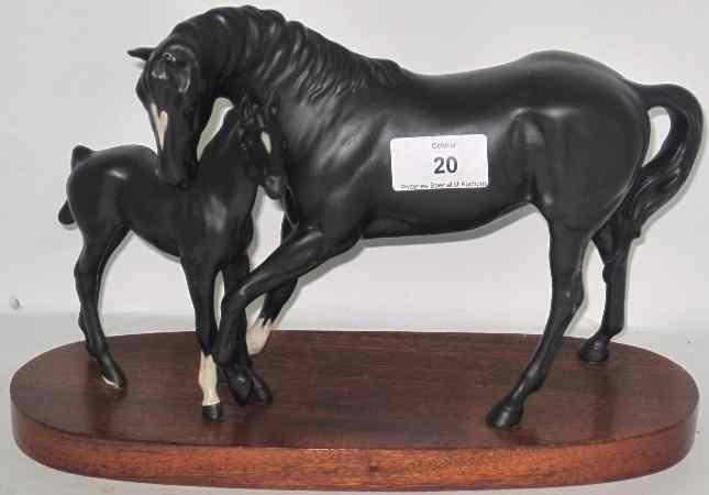 Appraisal: Beswick Black Beauty and foal on wood base chip to