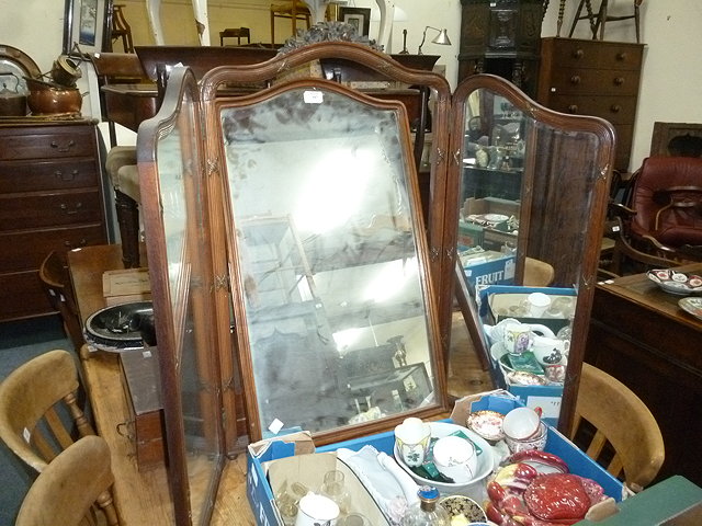 Appraisal: A WALNUT TRIPLE DRESSING TABLE MIRROR with shaped mirror plates