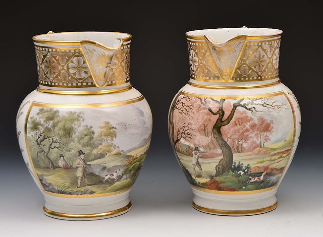 Appraisal: Pair of English porcelain large jugseach painted with panel of