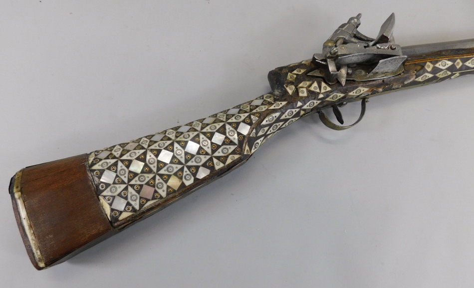 Appraisal: A Middle Eastern rifle with bone and mother of pearl