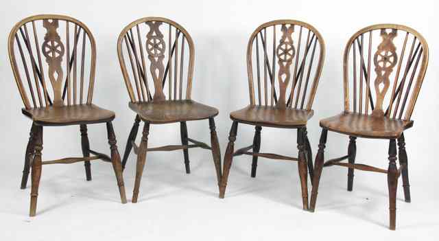 Appraisal: Four beech and elm wheelback Windsor chairs