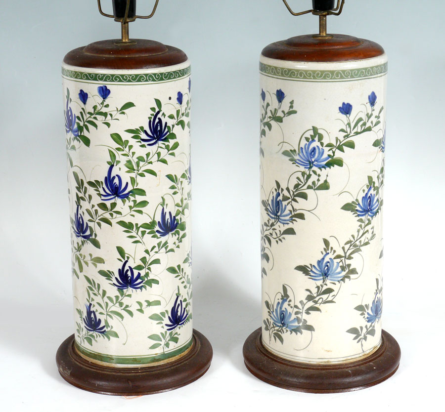 Appraisal: PAIR ORIENTAL EARTHENWARE LAMPS Floral motif pottery vases converted to