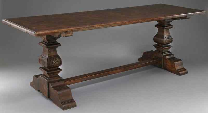 Appraisal: Italian renaissance style walnut trestle tableresting on carved legs joined