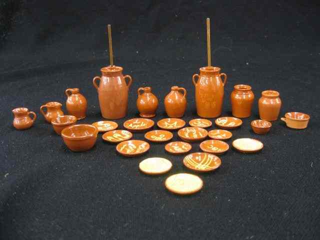 Appraisal: Collection of Pennsylvania Redware Potteryitems includes butter churns jugs pitchers