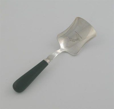 Appraisal: A George III caddy shovel with a green-stained ivory handle