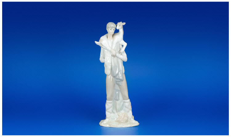 Appraisal: Lladro Figure Shepherd Carrying a Lamb Marks to Base Stands