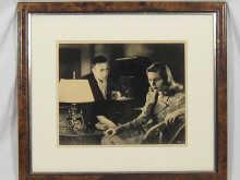 Appraisal: A framed photograph of Humphrey Bogart and Lauren Bacall x