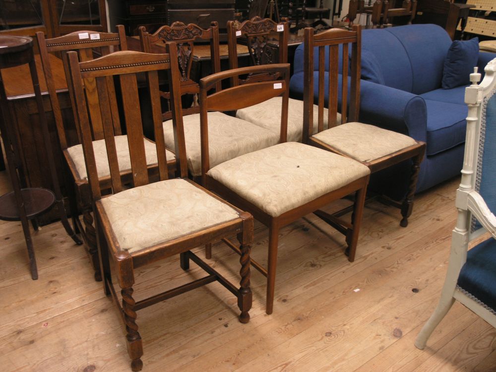 Appraisal: A pair of Edwardian carved walnut dining chairs with pierced