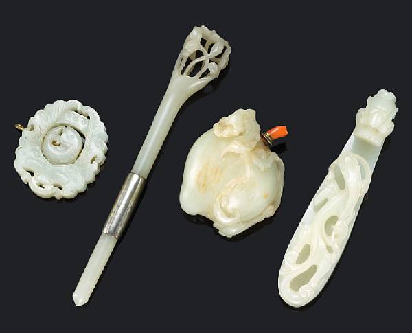 Appraisal: A group of four white jade articles Including a pebble-shaped