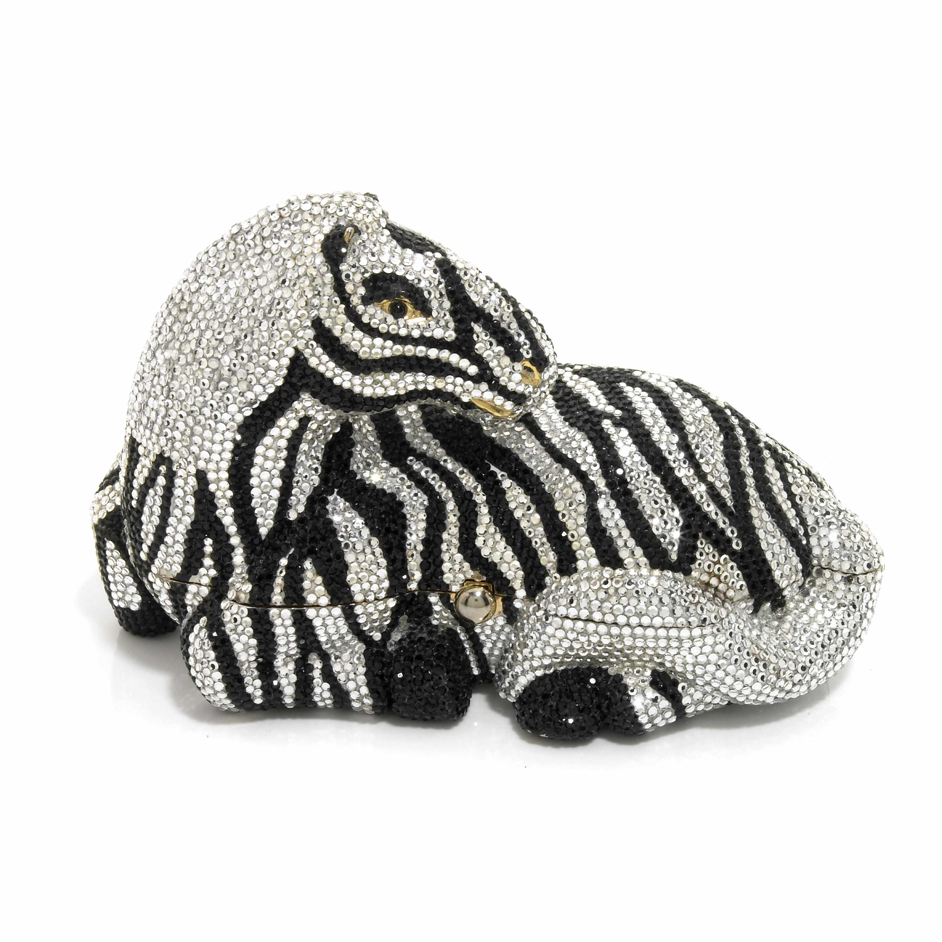 Appraisal: A black and silver crystal Botswana zebra minaudiere interior with