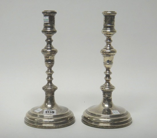 Appraisal: A pair of Elizabeth II silver table candlesticks each of