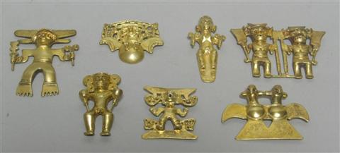 Appraisal: SEVEN PANAMANIAN HUACA FIGURES The gold plated figures including a