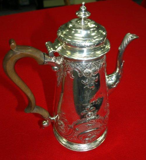 Appraisal: A Georgian coffee pot with hinged cover embossed flowers C