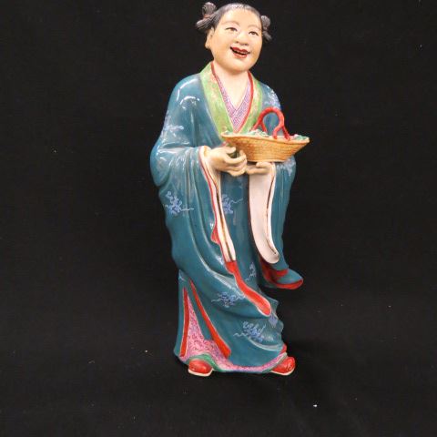 Appraisal: Chinese Porcelain Figurine of a Lady withbasket of radishes signed