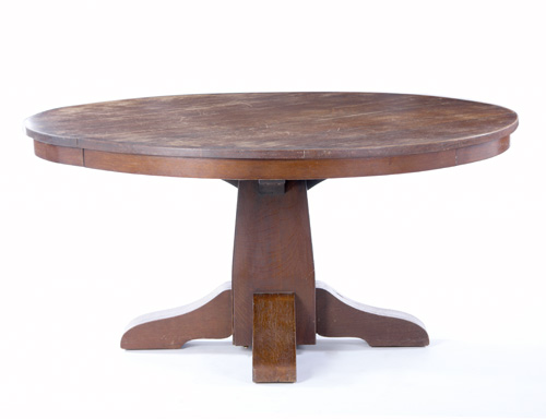 Appraisal: GUSTAV STICKLEY Dining table with a large flaring pedestal and