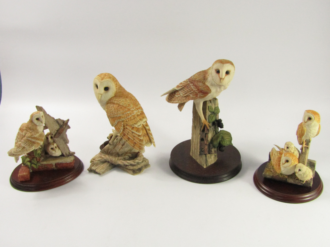 Appraisal: Four Border Fine Arts sculptures of owls comprising Barn owl