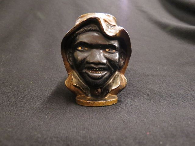 Appraisal: Black Americana Figural Cast Iron Bank two sided smiling faces