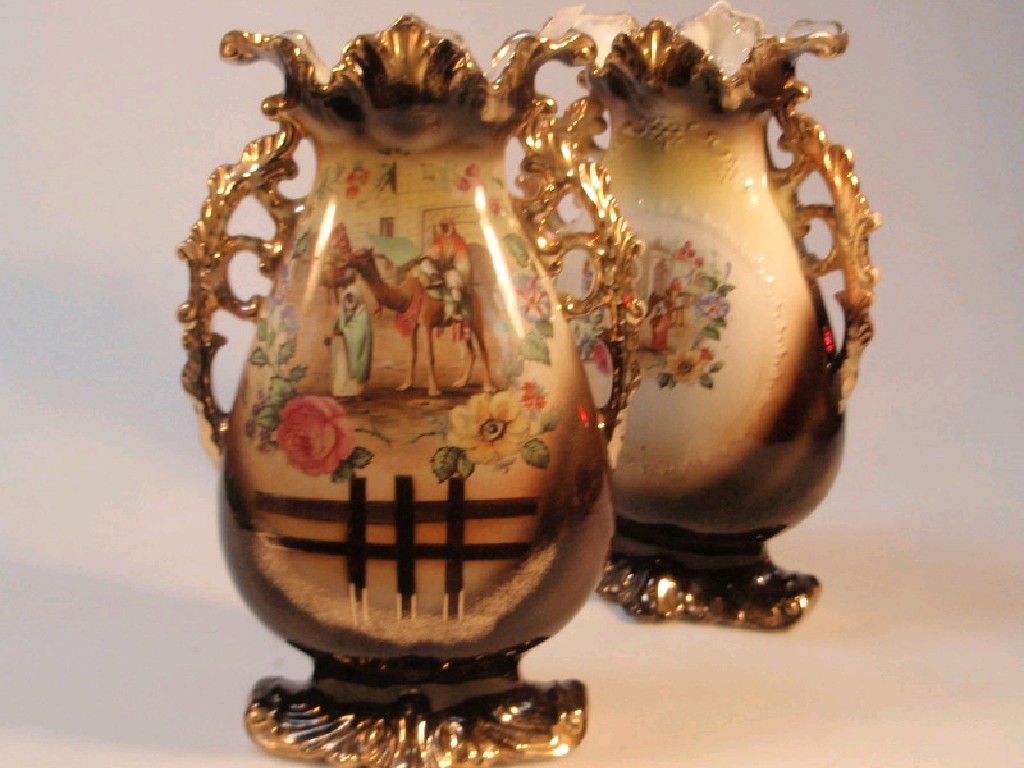 Appraisal: A pair of early thC Staffordshire gilt two handled vases