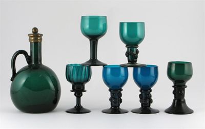 Appraisal: A green glass decanter with metal mounted stopper and six