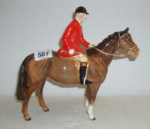 Appraisal: Standing Huntsman On Brown Horse