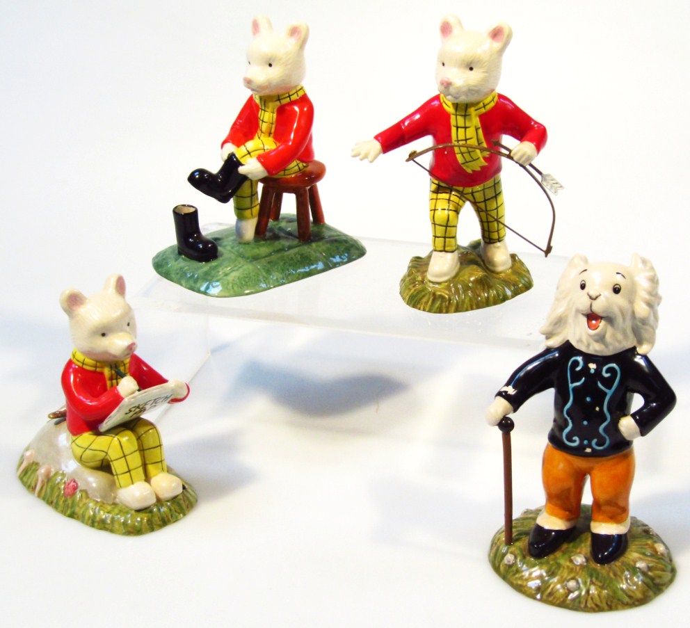 Appraisal: Four Royal Doulton Rupert The Bear porcelain figure groups Finishing