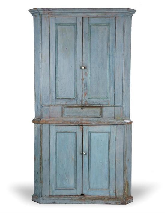 Appraisal: PAINTED CORNER CUPBOARD American th century pine Two-piece cupboard the