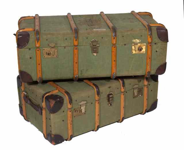 Appraisal: A GRADUATED SET OF TWO GREEN CANVAS COVERED TRAVELLING TRUNKS