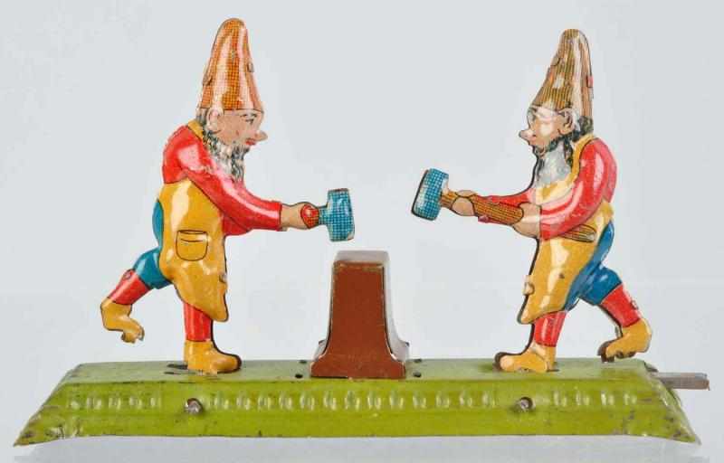 Appraisal: Tin Litho Gnomes Penny Toy German Push-lever activated Gnomes take