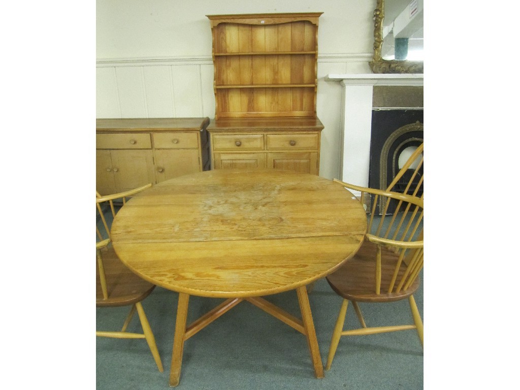 Appraisal: Ercol kitchen dresser drop leaf dining table and armchairs