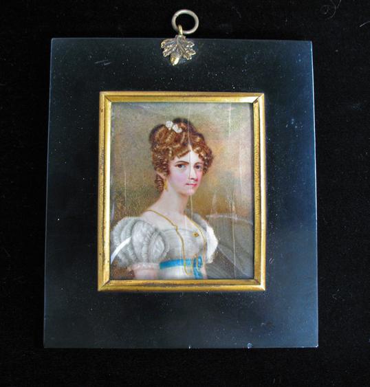 Appraisal: ENGLISH SCHOOL A portrait miniature of a young lady wearing